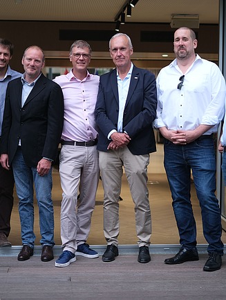 Foto van het projectteam van het nieuwe AT60 - Oostenrijkse Kamer van Koophandel in Brussel.