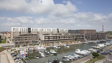 Photo du Quartier Bleu sur le Kanaalkom à Hasselt, un projet de développement multifonctionnel à grande échelle.