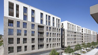 Foto van Quartier Bleu aan de Kanaalkom in Hasselt, een grootschalig multifunctioneel ontwikkelingsproject.