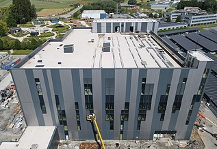 Drone image of the manufacturing building under construction for Takeda in Lessines.