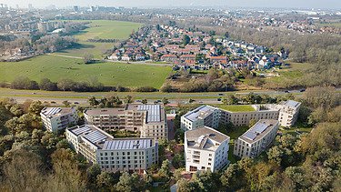 Image de synthèse du nouveau complexe WOL-U, un nouveau complexe résidentiel à grande échelle à Zaventem.