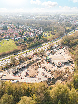 Luchtfoto van de werf WOL U, een grootschalig residentieel project in Zaventem.