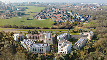 Renderbeeld van WOL-U project in Zaventem, een grootschalig en duurzaam woonproject.