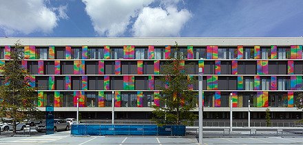 Photo of the colorful facade of Blok-K of the ZOL in Genk